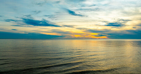 Enjoy a panoramic view of the skyline. The sun rises in the morning sky with colorful clouds. and beautiful cloud patterns In the soft light of the morning	