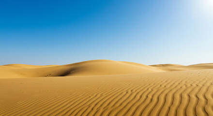  desert-inspired background featuring sweeping sand dunes, warm golden tones, and a clear blue sky