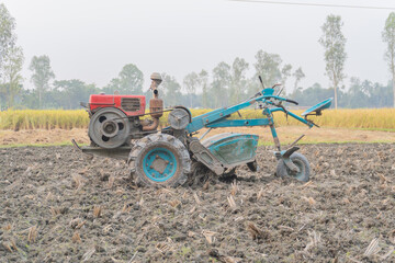 Tractor Plowing Field in Rural