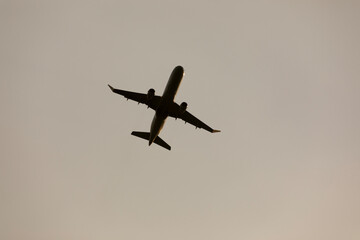 Airplane in the sky directly above