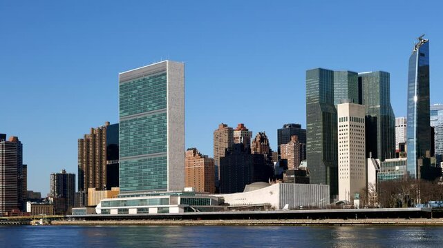  United Nations Headquarters from Roosevelt Island. View of NYC skyline at sunny day. High quality 4k footage