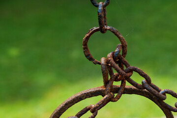 Old well bucket with a rusty chain, a life concept from a century ago. High-quality photo