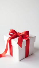 White background with an open gift box adorned in a bright red ribbon, wrapping, paper craft, present