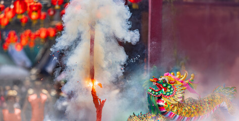 Traditional Chinese firecrackers are exploding with flashes and smoke in Lunar new year.