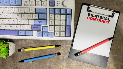 Concept of Bilateral Contract write on paperwork isolated on Wooden Table.
