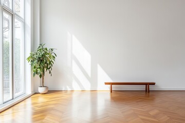 Large empty room with a wooden bench and a potted plant