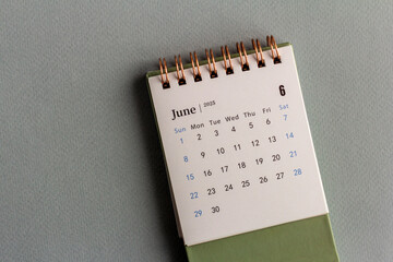 Desk calendar for June 2025. Planning calendar on a gray background.