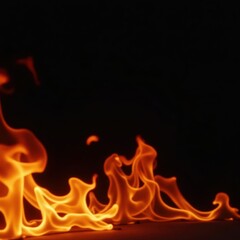 Fiery orange and yellow flames dance against a stark black backdrop , yellow, burning