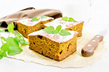 Cake pumpkin and chocolate on stone countertop