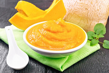 Pumpkin puree in plate on board