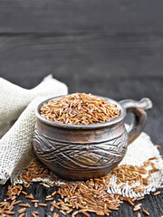 Rice red in cup on black board