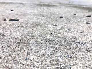 Gray concrete floor with rough texture. Cast road texture background