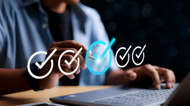 Businessman tick mark an assessment, online survey online exam choose the right answer in the exam, questionnaire, evaluation, filling out an online survey form. Answer the test questions concept.