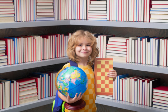 School boy with world globe and chess, childhood. Smart caucasian school boy kid pupil student going back to school. Education kids.