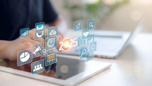 Businessman plans strategy marketing and finance for 2025, planning business growth with technology, AI, and environmental care to New Year resolutions business. digital transformation 2025