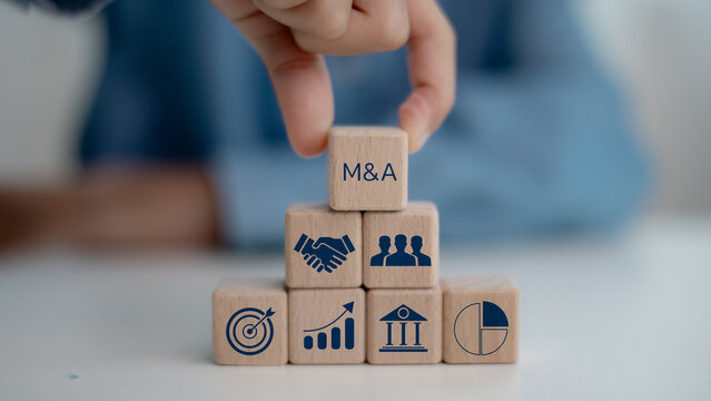 Business mergers and acquisitions concept. Share acquisition, asset business acquisition, amalgamation. Business review and development model. The abbreviation M and A on smart background, copy space.