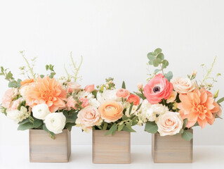 Obraz premium Beautiful floral arrangements in wooden boxes with peach and white flowers, creating serene and elegant atmosphere
