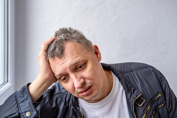 distorted face of sad and grieved very upset person, dissatisfied with his hard fate