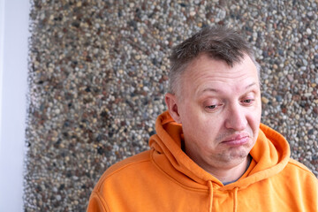 distorted face of sad and grieved very upset person, dissatisfied with his hard fate