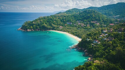 Fototapeta premium Aerial view of ocean inlet, with a beach, tropical vegetation and buildings