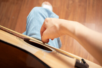 Hand Playing Acoustic Guitar Close-Up, person teaching instrument and musical skill, guitarist...