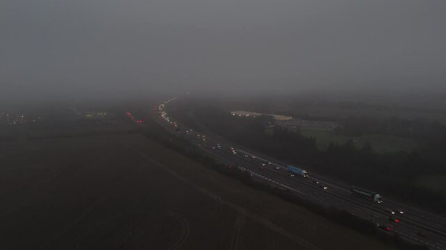 M11 motorway Essex UK in fog drone descends through fog