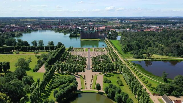 Flying Over The Lake And Baroque Garden To The Frederiksborg Castle In Hillerod, Denmark. - aerial shot