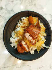 pork cutlet curry rice in a black plate