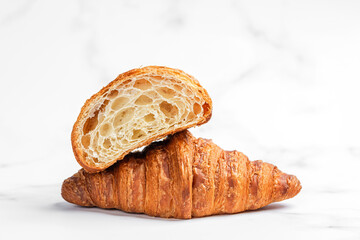 Croissants on white marble background