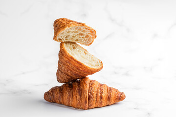 Croissants on white marble background