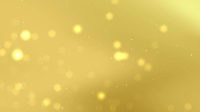 Gold background features blurry bright lights and tiny sparkles.