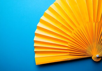 Yellow paper fan on a blue background