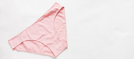 Pink women's underpants on a white background. Reusable menstrual underwear. Allergic to pads.