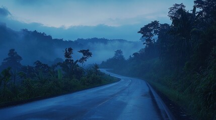 Misty Mountain Road at Dusk: A Serene Drive Through the Tropics