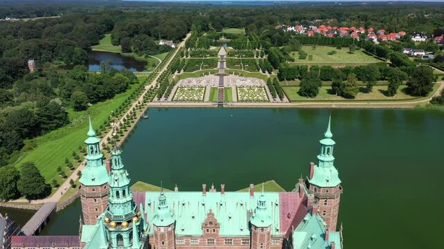 Frederiksborg Castle Baroque Garden In Daytime In Hillerod, Denmark. - aerial ascend shot