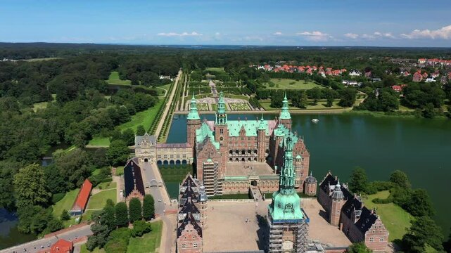 Frederiksborg Castle With Garden, Chapel, And Museum At Slotssoen In Hillerod, Denmark. - aerial shot