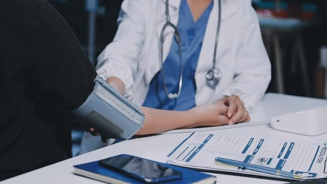 The doctor woman hand use the pulse meter to measure the pressure of the patient, medical checkup concept.
