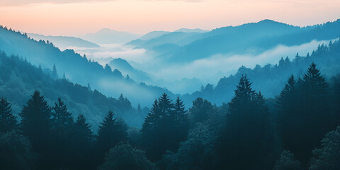 Obraz premium Misty Mountain Serenity: A captivating vista of rolling hills cloaked in a soft blanket of mist, the soft hues of dawn painting the sky in ethereal shades of blue.