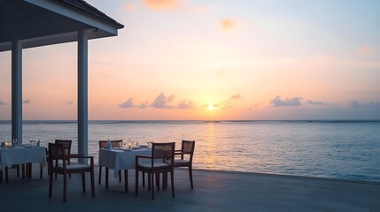 romantic ocean sunset dinner table - travel and tourism