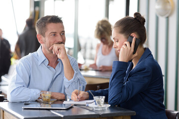 man and woman during meeting in restaurant