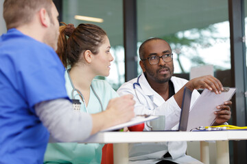 Fototapeta premium group of doctors involved in discussion at hospital