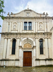 Obraz premium Ornate Church Facade with Columns and Sculptures. Saint Pietro in Oliveto, Italy