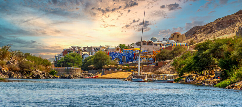 Scenic Nile River and Colorful Nubian Village in Aswan, Egypt at Sunset  