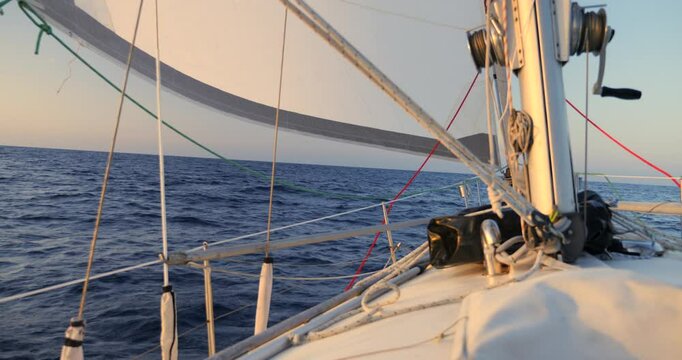 Rolling furler genova sail set on a sailboat sailing across the Bay of Biscay