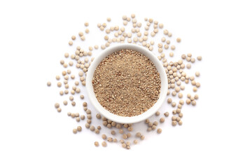 A bowl of Organic White Pepper (Piper nigrum) powder, placed over a heap of whole White Pepper. Isolated on a white background.
