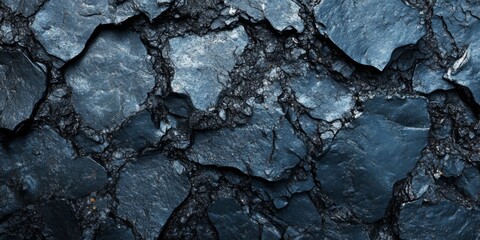 Close-up of cracked asphalt with detailed texture