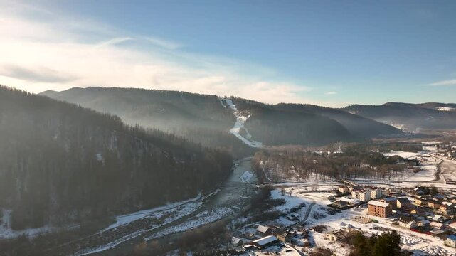 Drone video of Partia Soimul and Moldova River in Gura Humorului on a foggy winter morning