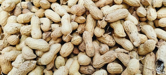 Pile of raw peanuts on a street market in India.