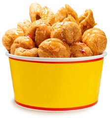 Deep fried fish balls in paper bucket isolated on white background, Deep fried fish balls with spicy sauce on white With work path.