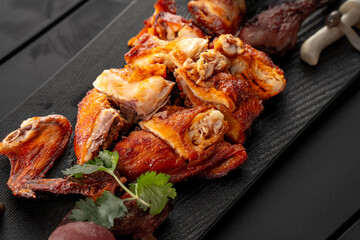 Mexican fried chicken placed on a black slate